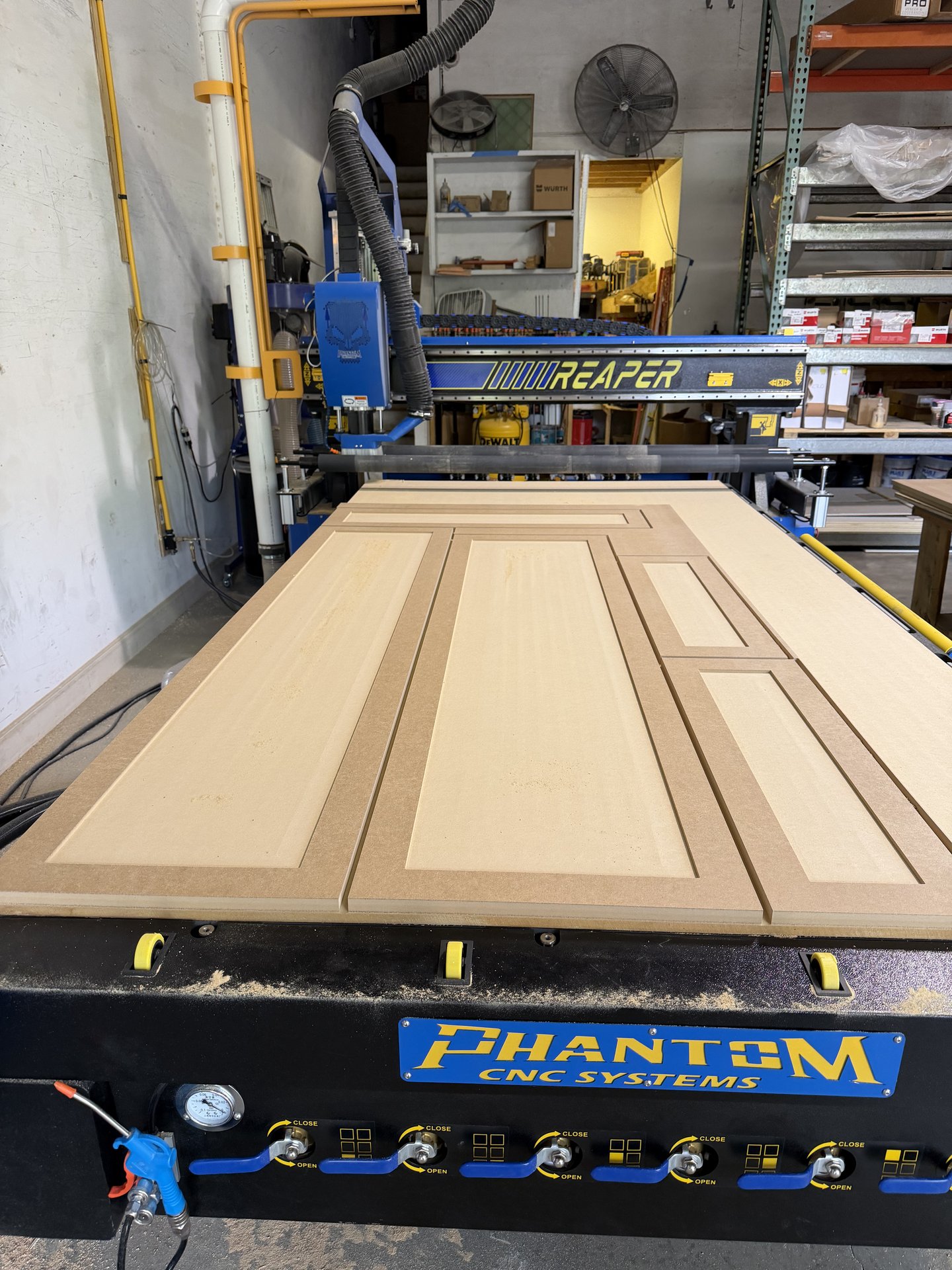 Phantom CNC router cutting cabinet door panels at Hatley Construction