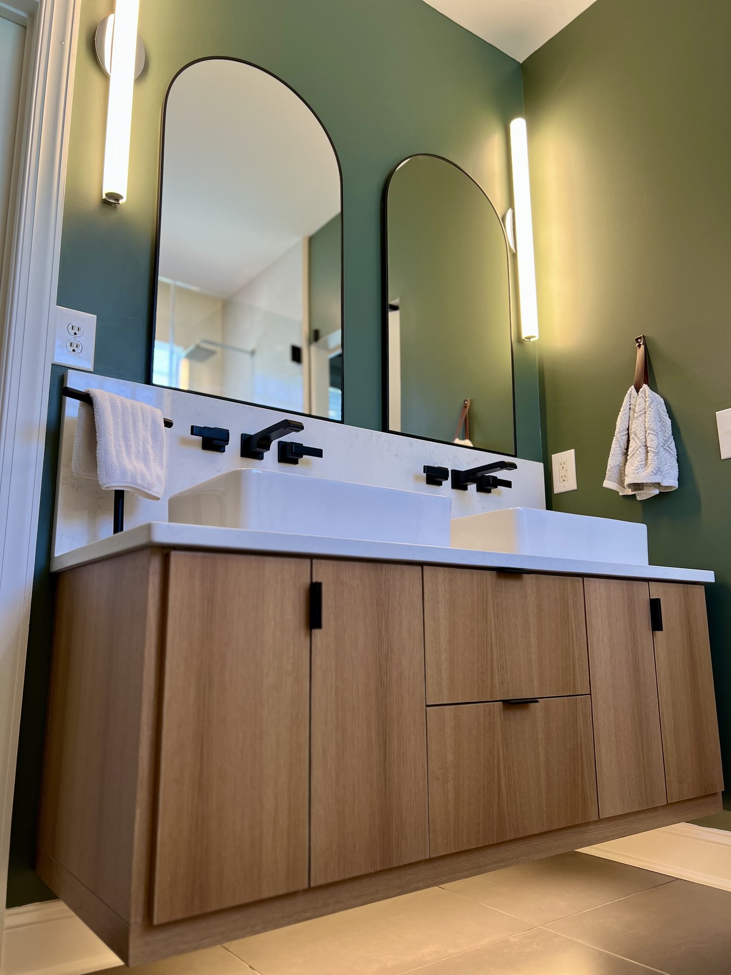 Custom white oak floating vanity by Hatley Construction