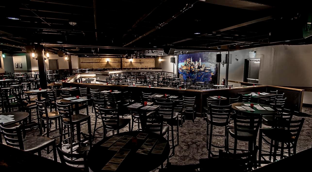 Restaurant bar with Nashville mural and custom wood bar top