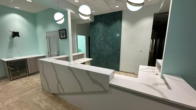 Commercial reception — green marble and quartz counter